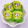A set of five lime green mermaid princess resin figurines with long wavy hair and yellow accents displayed in a white dish.
