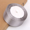 Roll of silver satin ribbon for crafts and gift wrapping