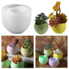 A collection of silicone arc candle jars in various shades of green, yellow, and pink, used for crafting and decor.