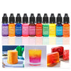 A collection of 20 liquid candle dye pigments in various colors including purple, orange, pink, and green, displayed alongsid