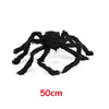 A large, black plush spider used as a Halloween decoration.