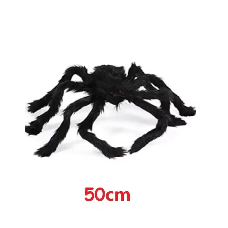 A large, black plush spider used as a Halloween decoration.