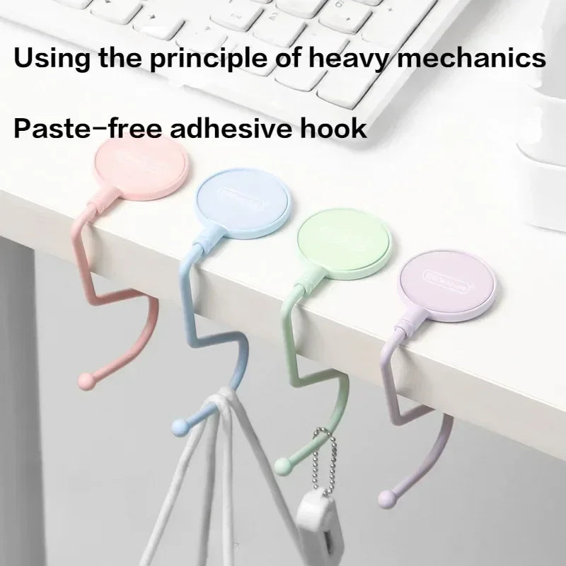 Paste-free adhesive hook in various pastel colors attached to a white surface.
