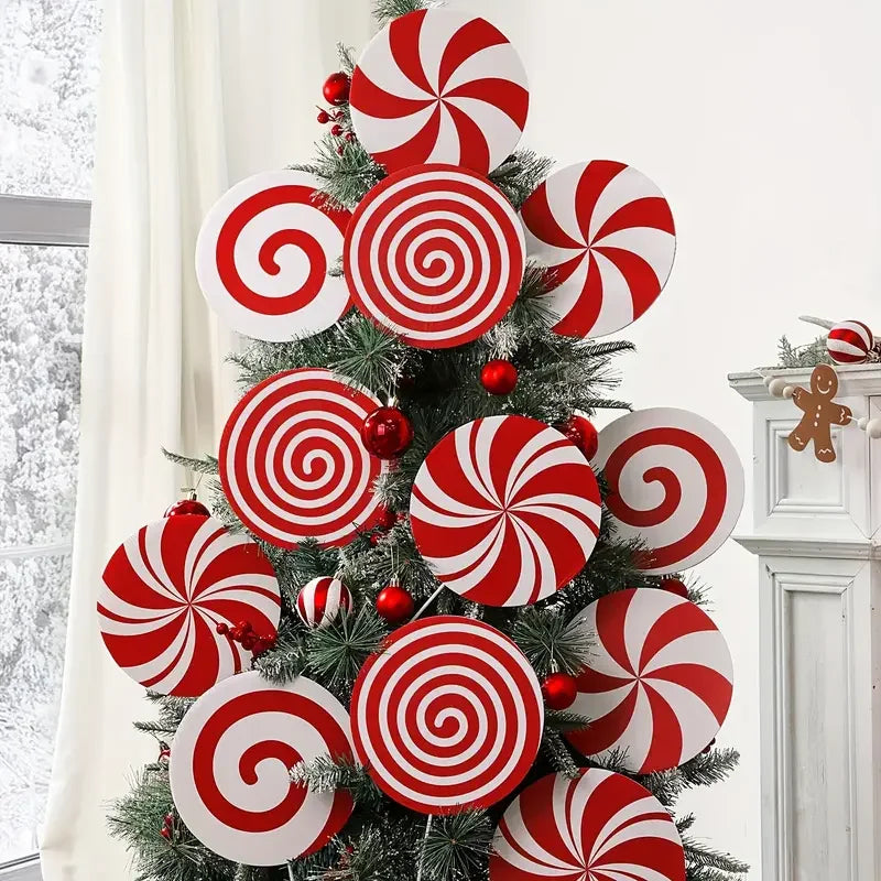 Christmas tree topper featuring red and white swirling peppermint designs