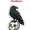 A black bird silhouette on a white background, used as a cartoon word resin flatback charm.