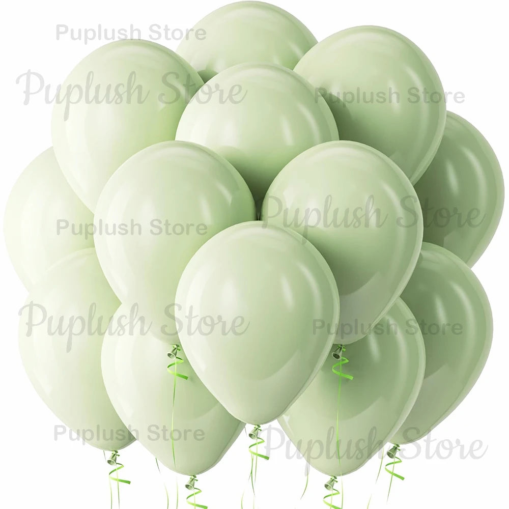 A cluster of pale sage green latex balloons tied with green ribbons.