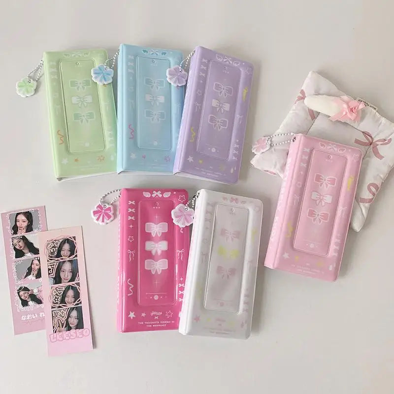 Una colección de álbumes de fotomatón de colores pastel en varios tonos de verde, azul, morado y rosa.