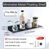 A minimalist metal floating shelf displaying a glass bottle and a jar on a black shelf.