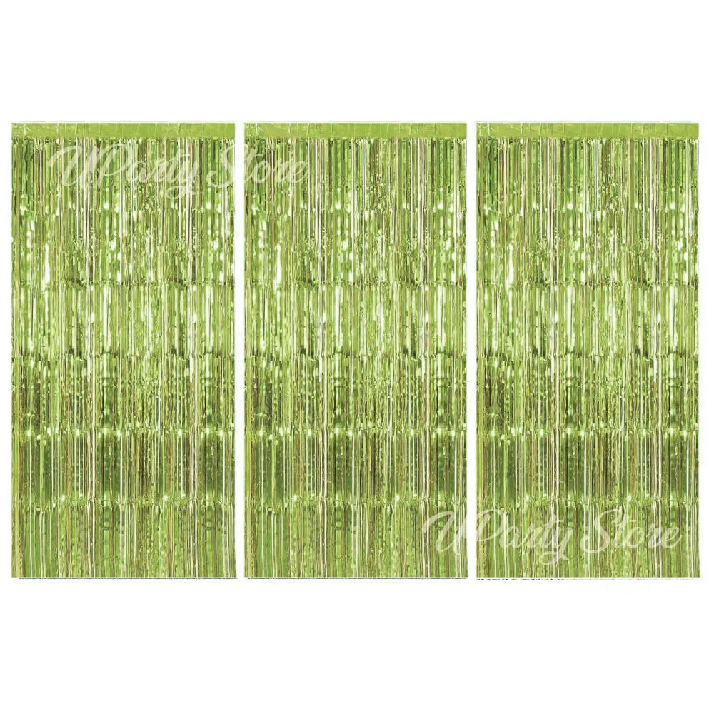 Three panels of shimmering metallic green fringe curtains for party backdrop decor