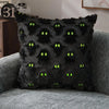 A black plush pillow cover decorated with green pumpkin ghost patterns for Halloween decor