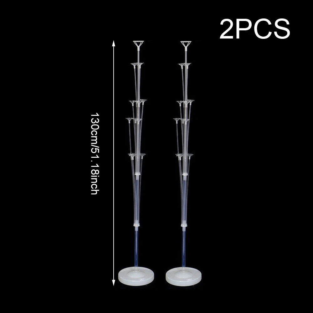 Two elegant balloon column stands with long metal rods and round bases.