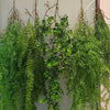 Artificial hanging ivy vine with green leaves displayed against a light background.