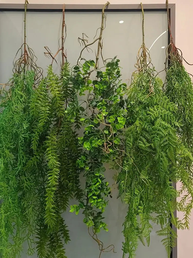 Artificial hanging ivy vine with green leaves displayed against a light background.