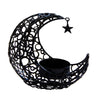 Black metal crescent moon candle holder with a star decoration