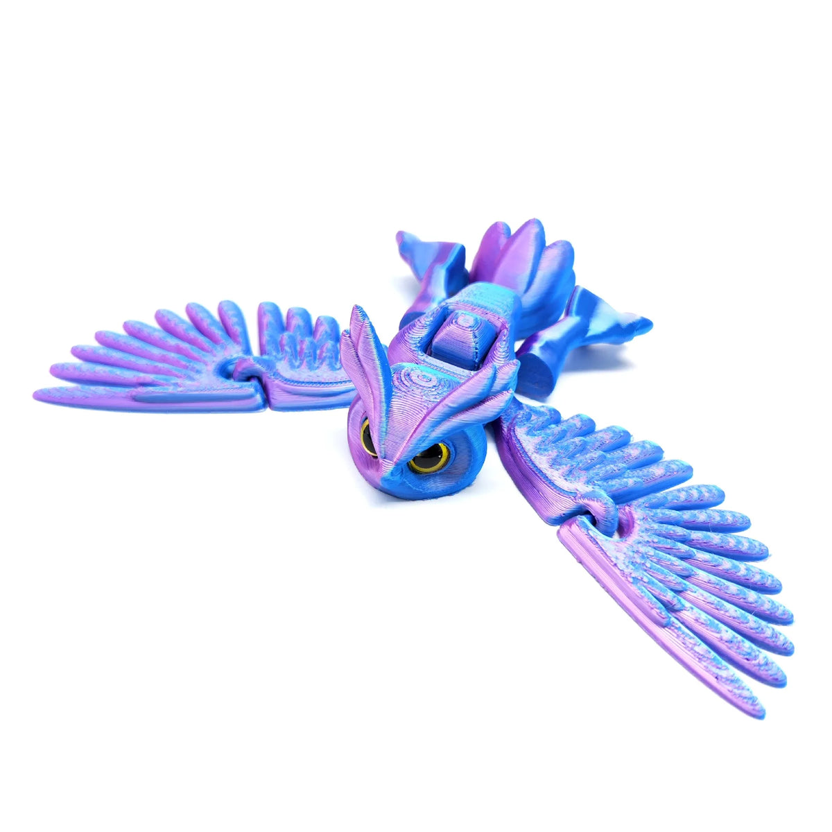 A purple and blue articulated 3D printed owl figurine with outstretched wings.