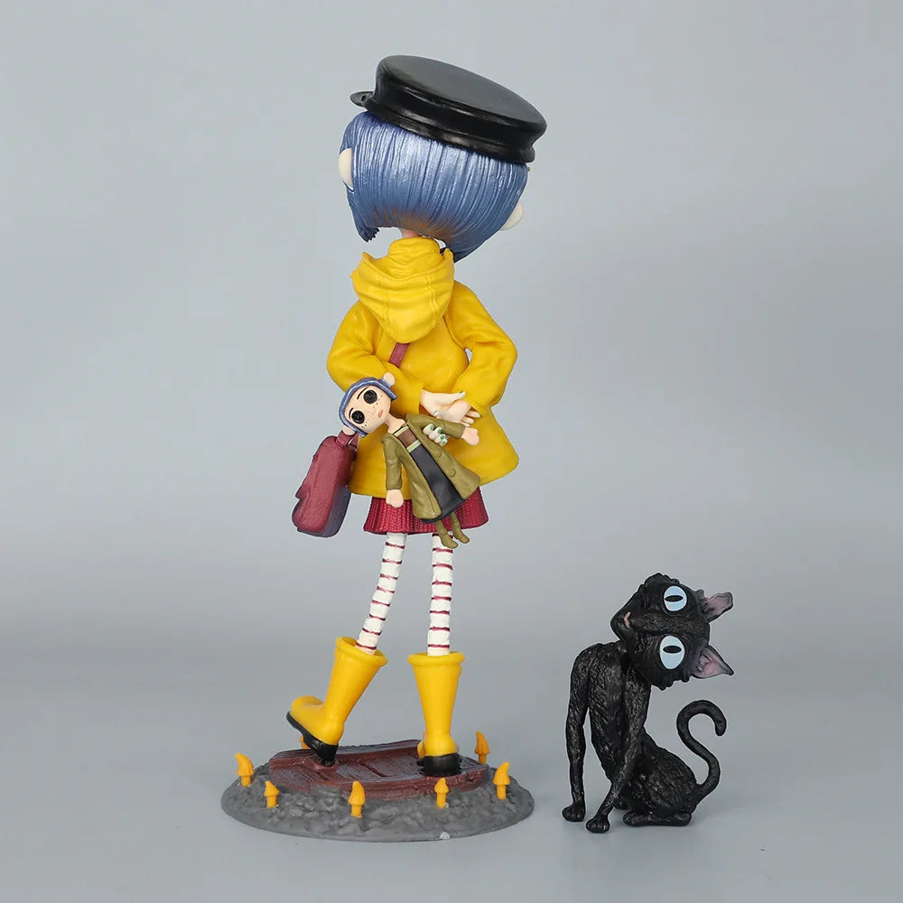 A figurine of a character with blue hair and a black hat, dressed in yellow and red clothing, standing next to a black cat.