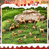 A set of mini deer figurines in various poses scattered across green grass.