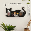 A black cat wall shelf displaying various candles and crystals, featuring a moon phase design.