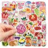 A hand is touching a sheet of retro cute food pattern decals featuring various fruits and vegetables.