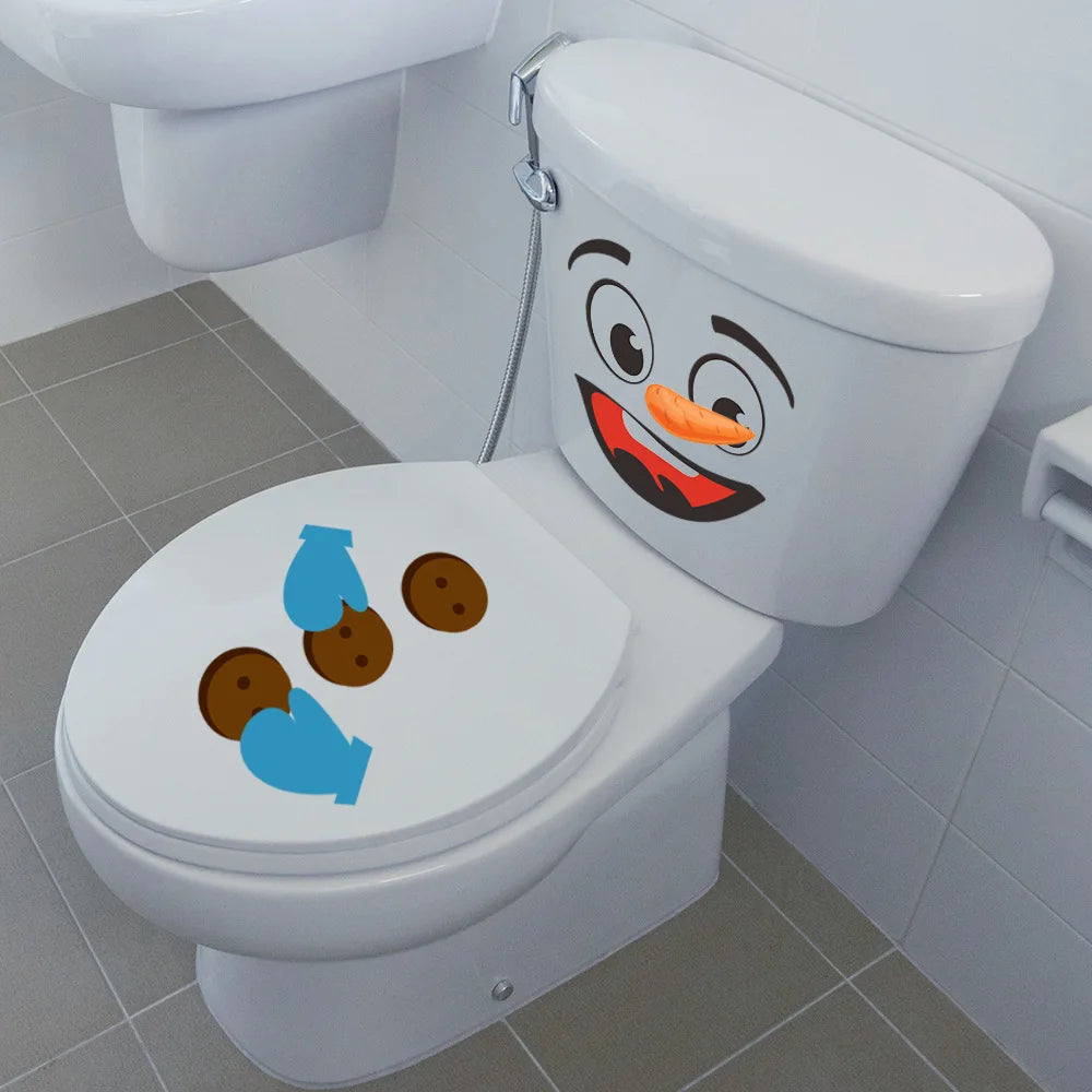 A white toilet with a funny cartoon face decal featuring an orange nose and smiling eyes.