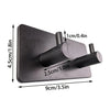 A black extra thick self-adhesive wall hook designed for hanging keys and jewelry.