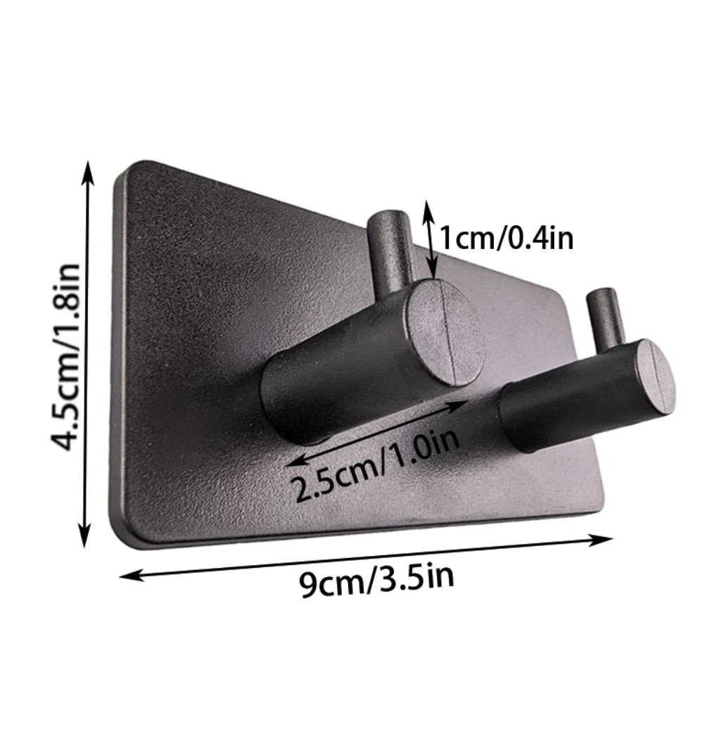 A black extra thick self-adhesive wall hook designed for hanging keys and jewelry.