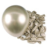 A large, smooth, chrome metallic latex balloon next to a cluster of crumpled metallic foil balloons.