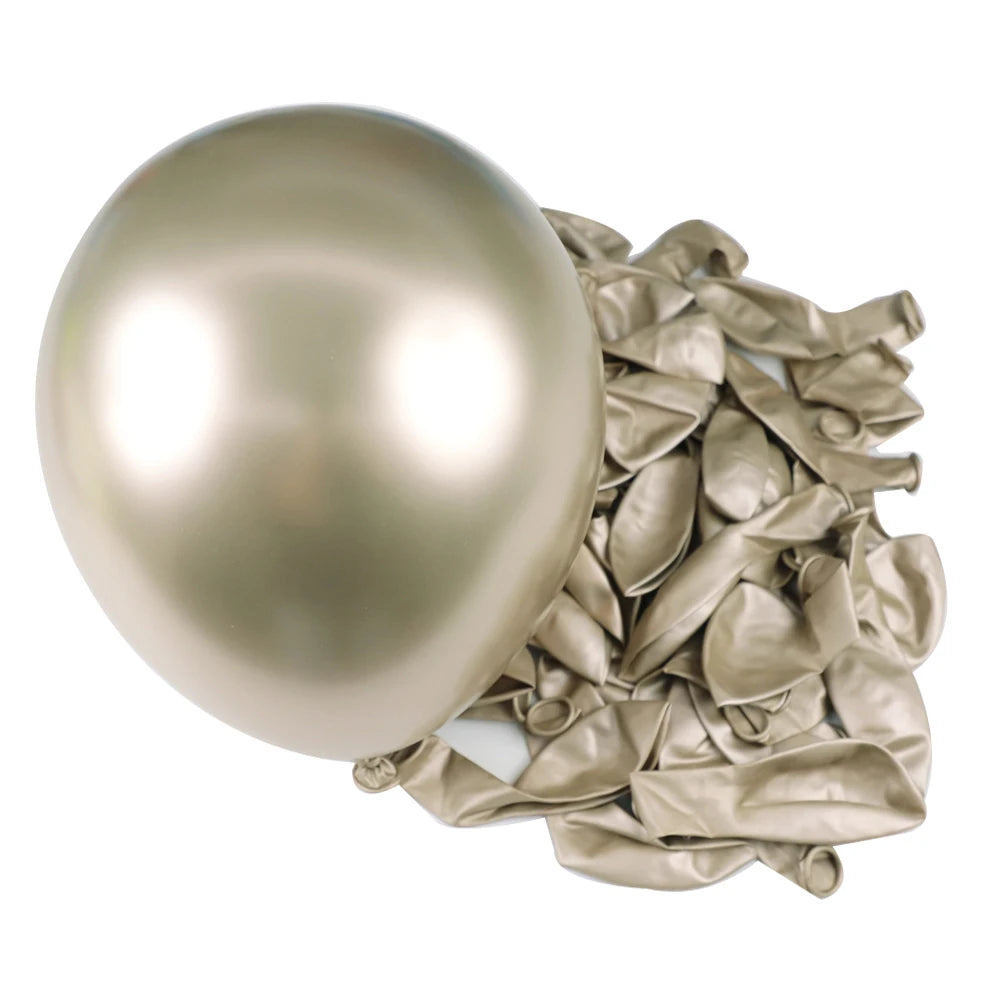 A large, smooth, chrome metallic latex balloon next to a cluster of crumpled metallic foil balloons.