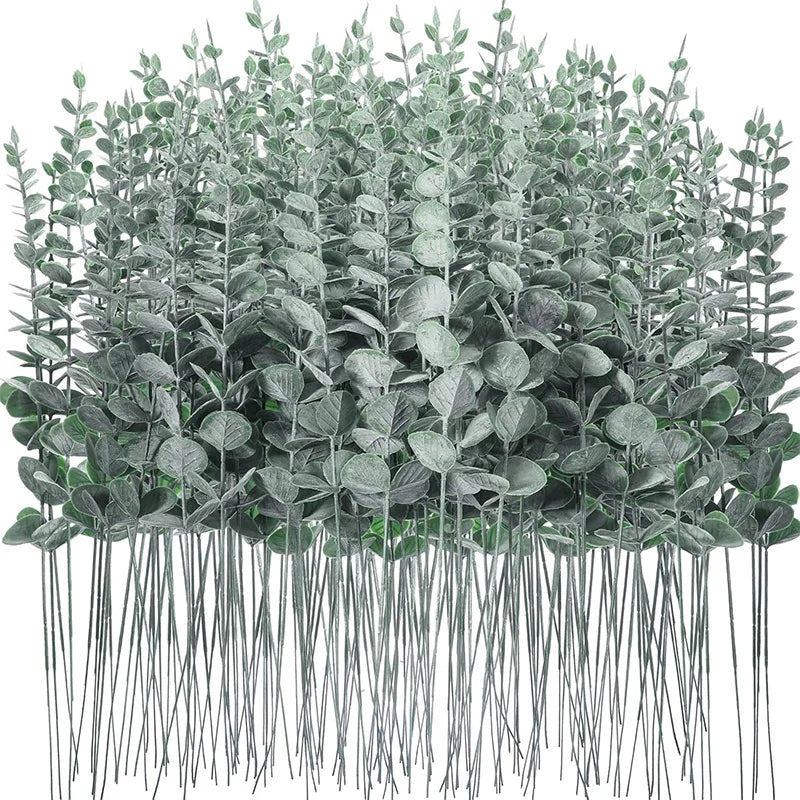 A dense arrangement of artificial eucalyptus leaf plants used for home decor and events.