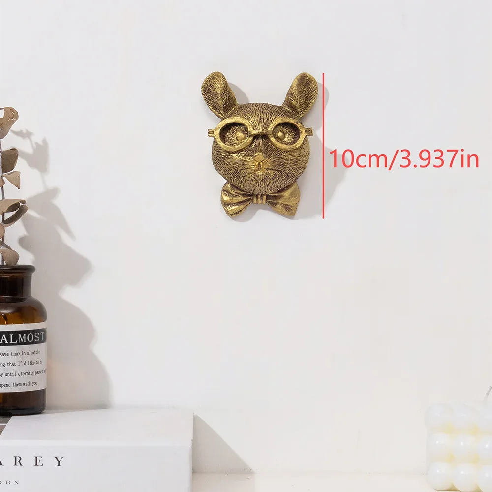 Gold-toned deer head storage hook wall decor with a ribbon, measuring 10cm.
