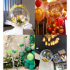 A collection of large clear bubble balloons in various colors including gold, red, and green for party decorations.