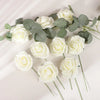 A collection of white foam rose stems and dusty green eucalyptus leaves arranged on a white surface.