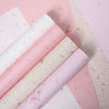 Rolls of pink and white decorative packaging paper for gifts and weddings