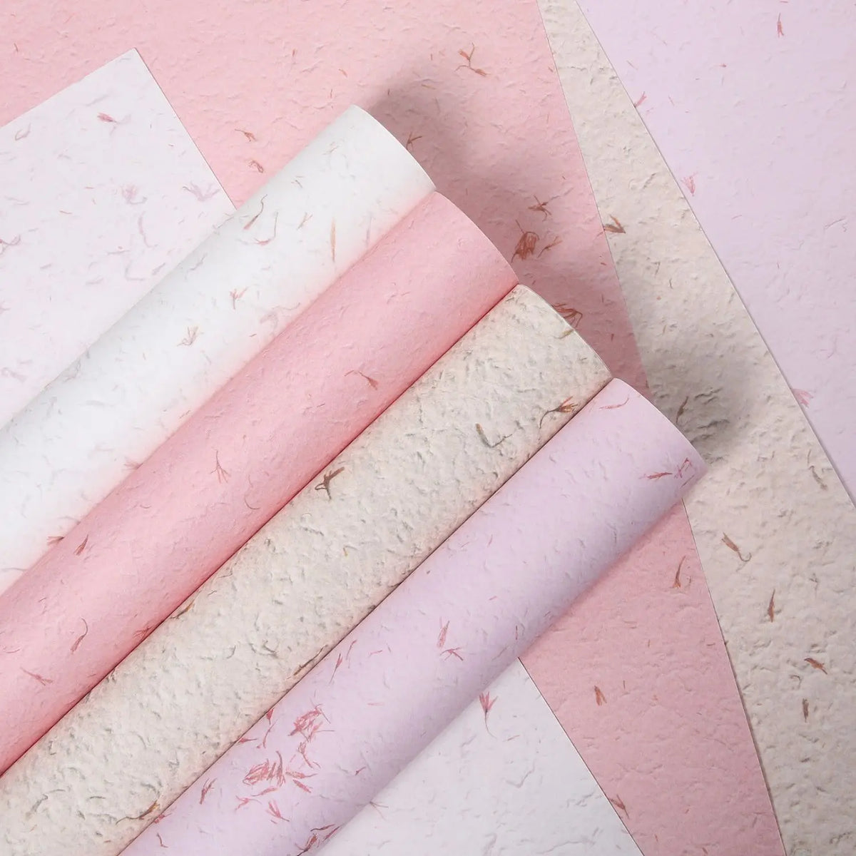 Rolls of pink and white decorative packaging paper for gifts and weddings