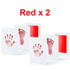 Two white cards showing red handprints and footprints on a white background