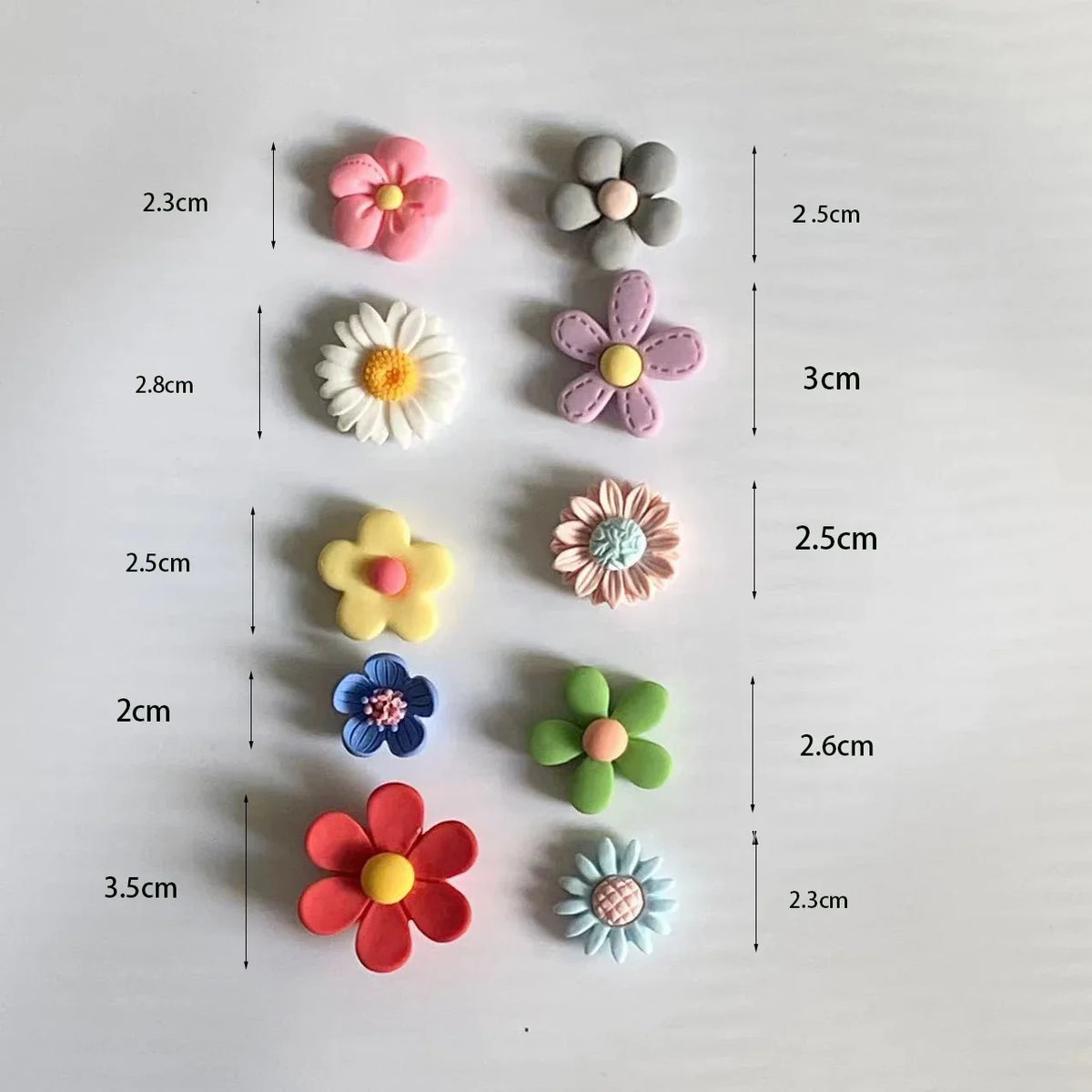 A collection of mixed color flower photo message magnets arranged in a grid with various sizes.