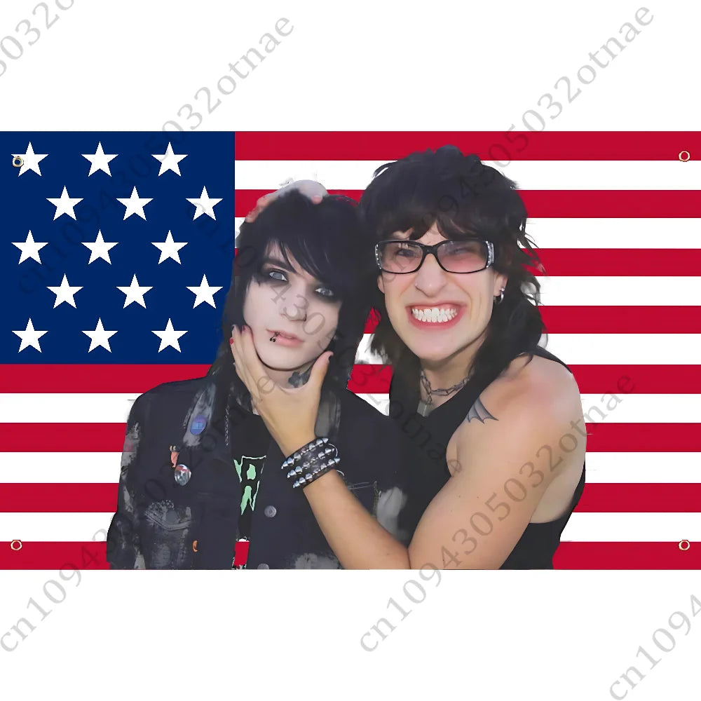A woman with dark hair and glasses is positioned against an American flag background.