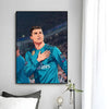 A modern wall art print featuring a portrait of Cristiano Ronaldo in a blue football jersey against a dark background.