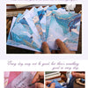 A presentation of gradient wash retro decorative paper packs showing various shades of blue and teal.