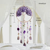 A crystal tree of life sun catcher wall decor featuring a purple amethyst sphere and hanging crystals.