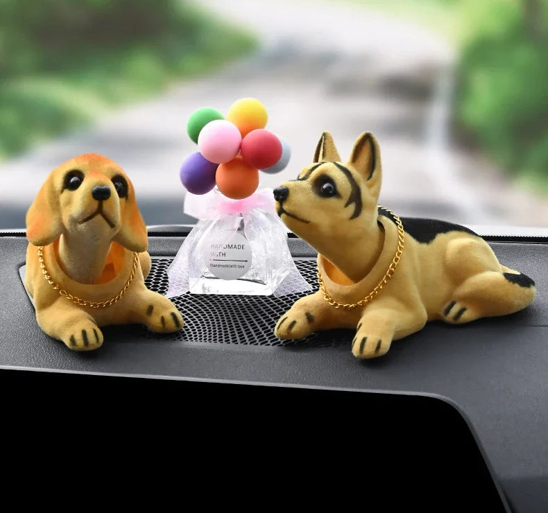 A set of multi-figure dog ornaments, including a golden retriever and a Japanese Spitz, with colorful balloons in the backgro