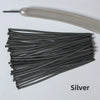 A bundle of silver latex strip balloons and a smooth, light-colored tube are shown.