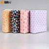 Three colorful photo cartoon memory albums in orange, dark blue, and light purple.