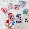 A collection of pink and green cartoon milk bottle photo keychains displayed on a white plate.