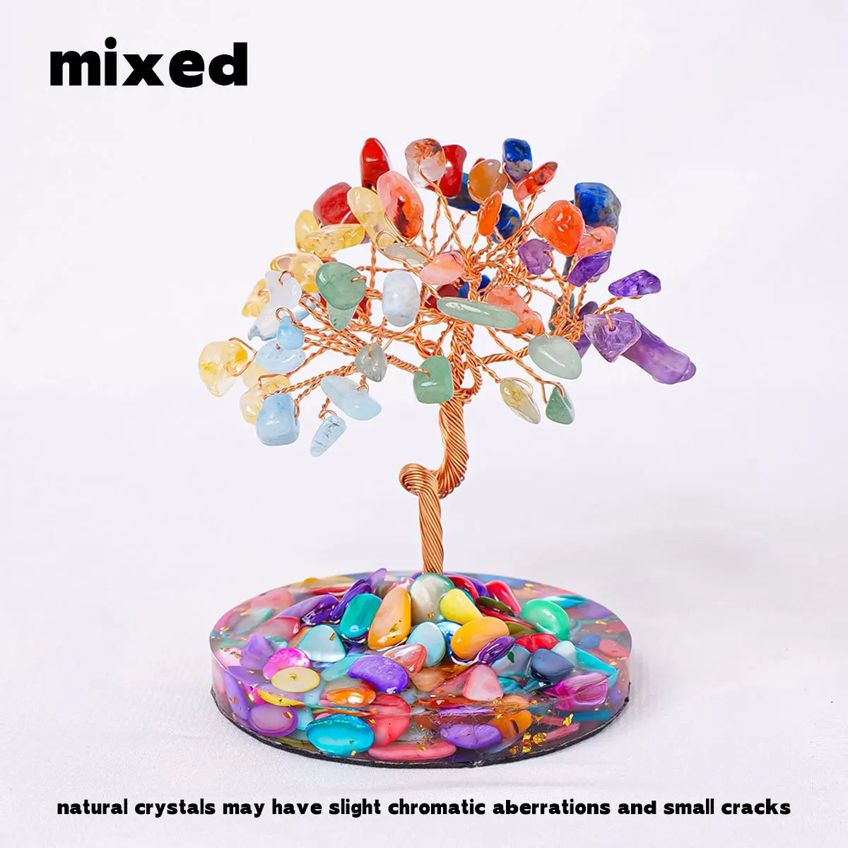 A natural crystal tree featuring various colored crystals on a stand with a colorful base.