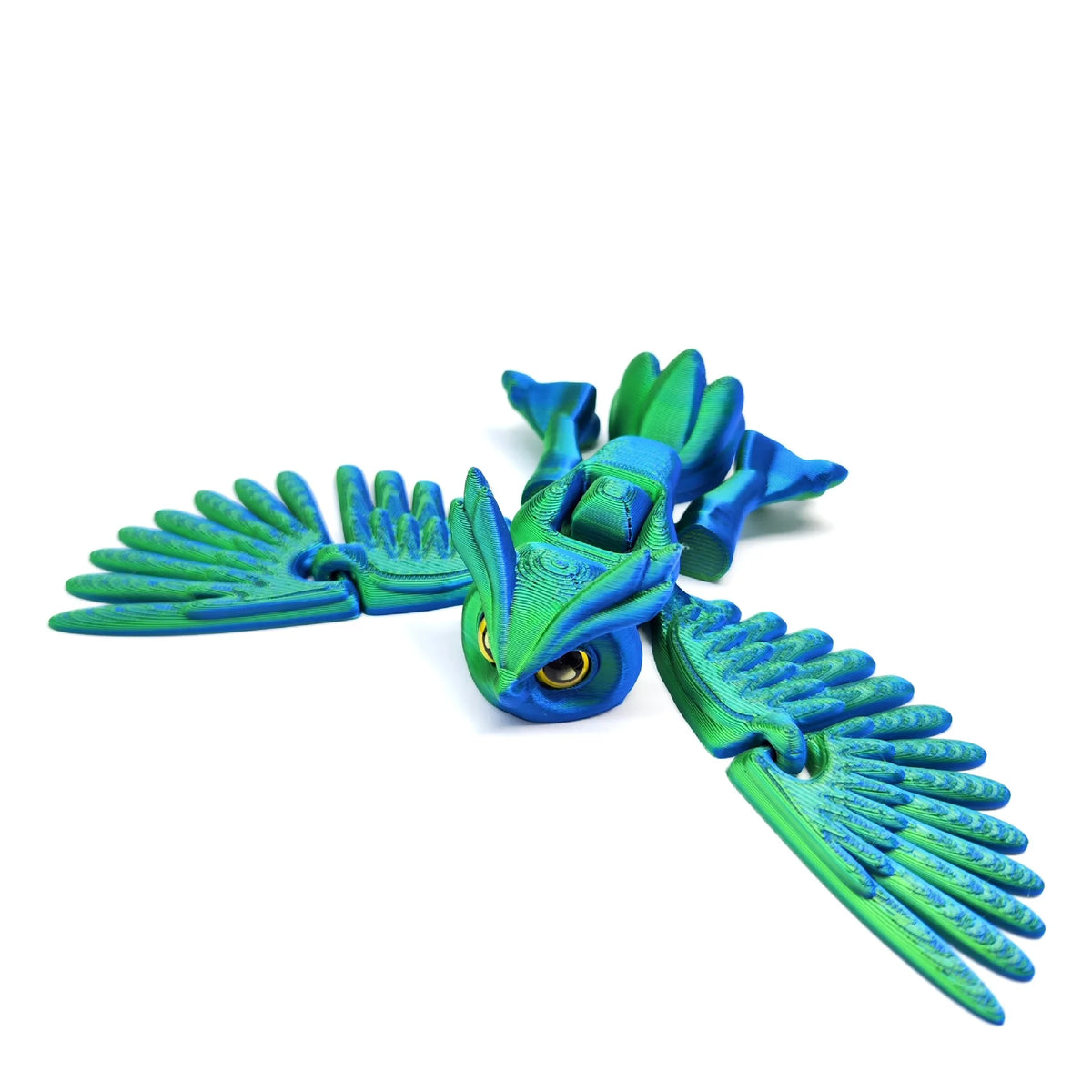 A vibrant teal and blue articulated 3D printed owl figurine with outstretched wings.