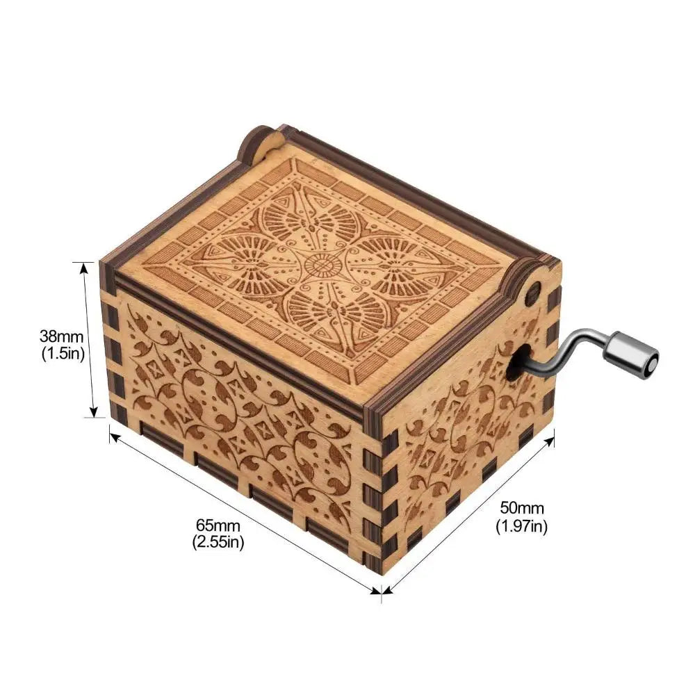 A vintage hand-cranked wooden music box with intricate wood carving details.