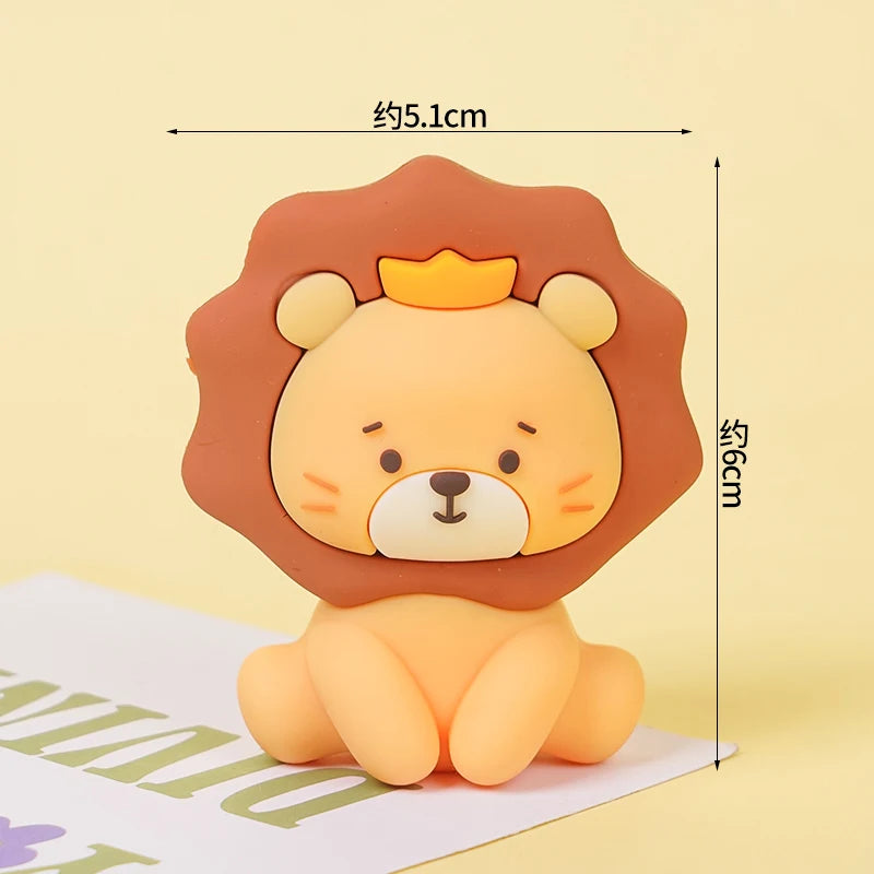 A cute lion face cake topper in orange and yellow, featuring a mane and crown.