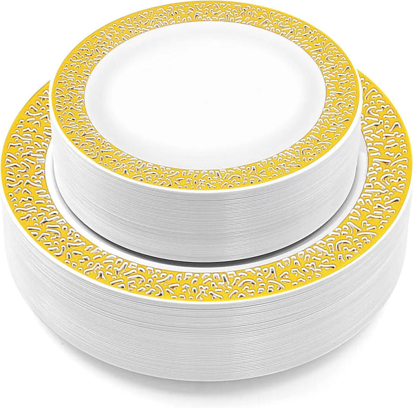 A stack of white plastic dinner and dessert plates with an elegant gold rim.