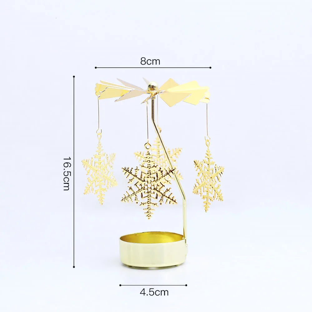 Gold rotating candle holder with a spinning carousel design featuring decorative gold snowflakes.